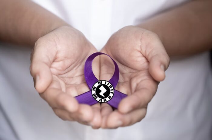 Hands holding a purple awareness ribbon with an AR marker, from the Domestic Violence Awareness AR piece